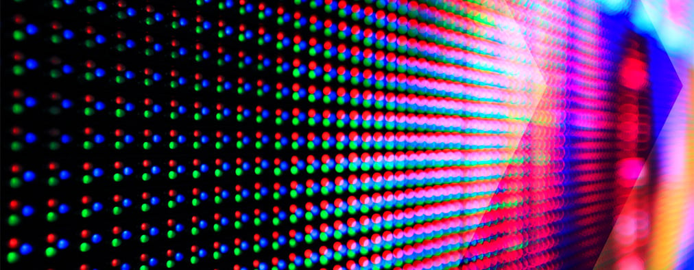 Extreme closeup of colorful video image, showing pixels
