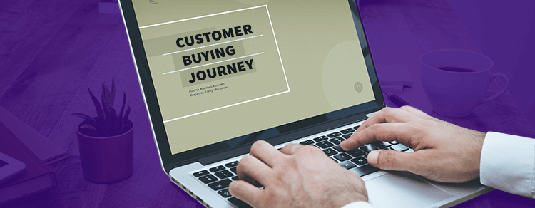 laptop with customer buying journey infographic on screen