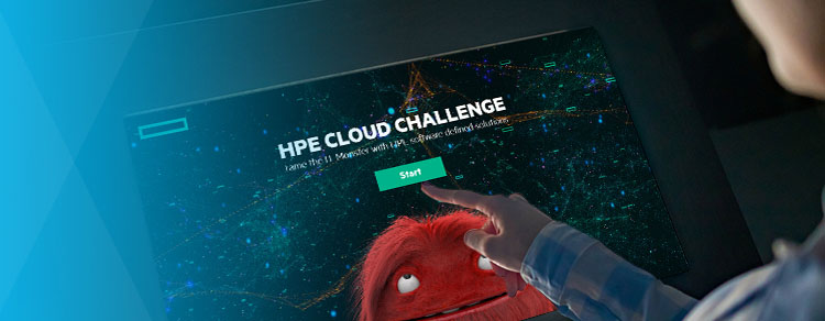 event attendee with finger about to tap the start button on screen displaying the HPE Cloud Challenge with I T monster in red